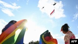 This picture taken on June 18, 2022, shows supporters attending the annual "Pink Dot" event in a public show of support for the LGBT community at Hong Lim Park in Singapore.