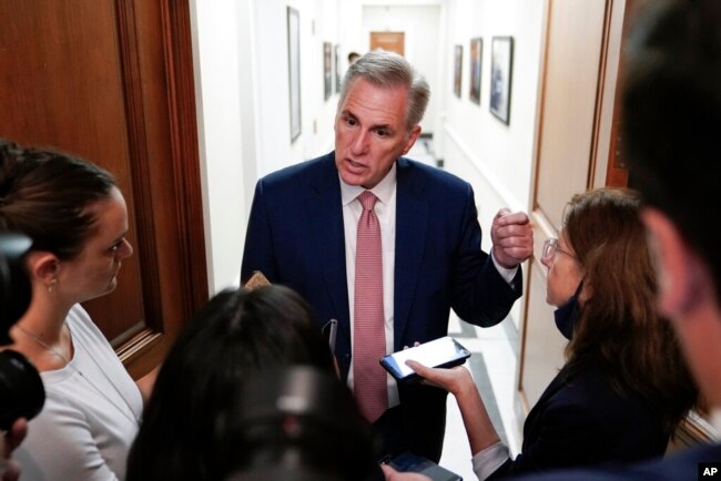 FILE - House Minority Leader Kevin McCarthy of California speaks with reporters on Capitol Hill in Washington, Aug. 12, 2022.