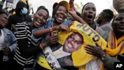 Supporters of Deputy President and presidential candidate William Ruto celebrate his victory over opposition leader Raila Odinga in Eldoret, Kenya, Aug. 15, 2022. (AP Photo/Brian Inganga)