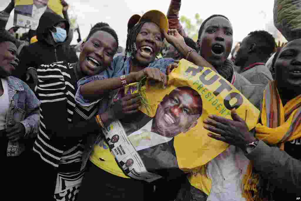 Supporters of Deputy President and presidential candidate William Ruto celebrate his victory over opposition leader Raila Odinga in Eldoret, Kenya.(AP Photo/Brian Inganga)