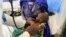 Aisha Usman, a 14-month-old malnourished child, receives treatment at a stabilization center in Damaturu, Yobe, Nigeria, Aug. 24, 2022.
