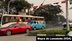 FILE: Cars drive under UNITA flags at Praça da Independência (Independence Square) in Luanda. Taken 8.16.2022