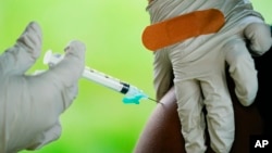 In this file photo, a health worker administers a dose of a Pfizer COVID-19 vaccine during a vaccination clinic in Reading, Pa., Sept. 14, 2021. (AP Photo/Matt Rourke, File)