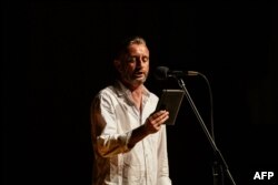 FILE - Ukrainian novelist and poet Serhiy Zhadan recites his poems in the House of Cinema in Kyiv, amid Russia's invasion of Ukraine, Aug. 13, 2022.