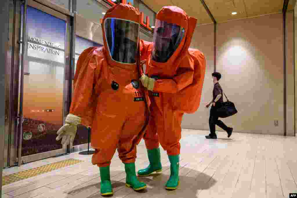 South Korean emergency workers wearing protective clothing take part in an anti-terror and anti-chemical terror drill on the sidelines of the joint South Korea-U.S. Ulchi Freedom Shield (UFS) military exercise, at a shopping mall in Seoul.