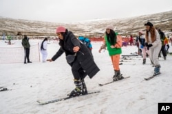 First time skiers take a lesson at the Afriski ski resort near Butha-Buthe, Lesotho, Saturday July 30, 2022. (AP Photo/Jerome Delay)