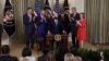 U.S. President Joe Biden is applauded after signing the Inflation Reduction Act of 2022 into law, in the State Dining Room of the White House in Washington, Aug. 16, 2022. 