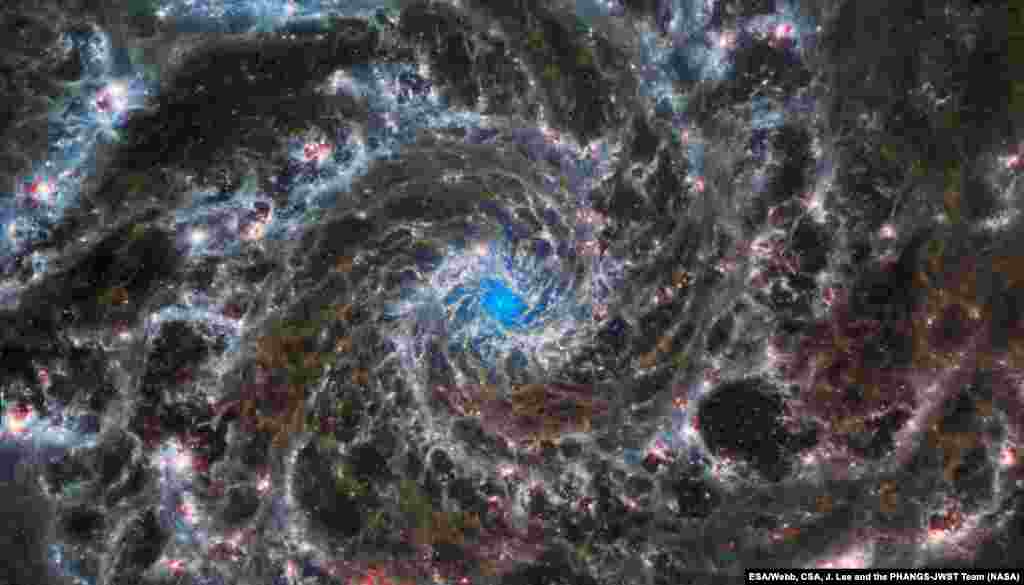 This image shows the heart of M74, otherwise known as the Phantom Galaxy.&nbsp;Webb&rsquo;s sharp vision has revealed delicate filaments of gas and dust in the grandiose spiral arms which wind outwards from the centrt of this image.&nbsp;