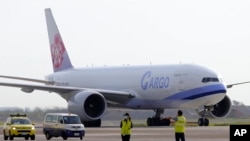 FILE - In this photo released by the Taiwan Centers for Disease Control, a China Airlines cargo plane carrying COVID-19 vaccines from Memphis arrives at the airport outside Taipei, June 20, 2021.