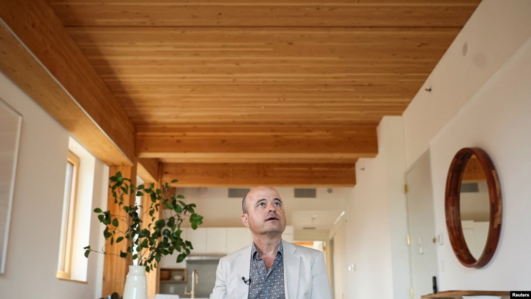 Eric Liftin, principal of Mesh Architectures and the condo's architect and co-developer, speaks during an interview inside an apartment at Timber House, the city's first mass-timber condo building, in New York City, Aug. 16, 2022.