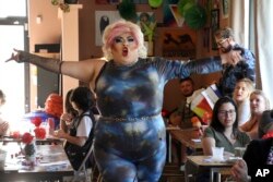Drag queen Dela Rosa performing in a mock election at Cafecito Bonito in Anchorage, Alaska, where people ranked the performances by drag performers, July 28, 2022.