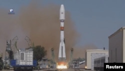 A Soyuz-2.1b rocket booster with the Iranian satellite Khayyam blasts off from the launchpad at the Baikonur Cosmodrome, Kazakhstan, Aug. 9, 2022, in this still image taken from video. (Roscosmos/Handout via Reuters)