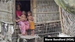 A Rohingya family at a settlement village near Sittwe in August 2017, a few days after the clearance operation began. Travel restrictions forbid anyone in the village from traveling.