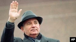 FILE - Soviet President Mikhail Gorbachev waves from the Red Square tribune during a Revolution Day celebration, in Moscow, Soviet Union, Nov. 7, 1989.