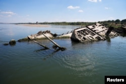 FILE - Wreckage of a World War Two German warship is seen in the Danube in Prahovo, Serbia August 18, 2022. (REUTERS/Fedja Grulovic/File Photo)