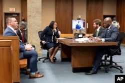 Fulton County prosecutor Fani Willis, center, and her team, during proceedings to seat a special purpose grand jury in Fulton County, Georgia, on May 2, 2022, to look into the actions of former President Donald Trump and his supporters.