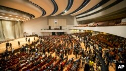 FILE - Followers of Shiite cleric Muqtada al-Sadr fill the parliament hall during a sit-in protest, in Baghdad, Iraq, Aug. 4, 2022, amid a political stand-off.