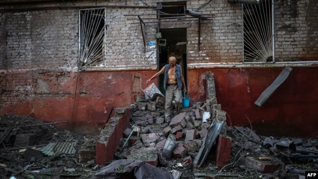 FILE - G7  A man leaves his damaged apartment building following a missile strike in Kramatorsk, Donetsk region, Ukraine, Aug. 31, 2022, amid the Russian invasion of Ukraine.