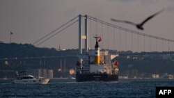 The Panama-flagged bulk carrier Navi Star carrying tons of grain from Ukraine sails along the Bosphorus Strait past Istanbul on Aug. 7, 2022, after being officially inspected. 