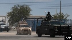 Members of the National Guard and the Mexican army leave the airport after landing in Ciudad Juarez, Chihuahua, Mexico, on Aug. 12, 2022, after a rash of violence in the city.