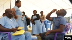 FILE - Malawian journalist Kenneth Jali takes the cholera vaccine during the launch of the vaccination campaign in Blantyre, May 23, 2022. (Lameck Masina/VOA)