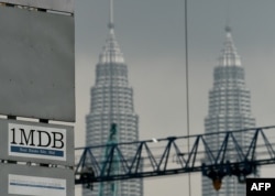 In this file photo taken on July 3 2015 the 1 Malaysia Development Berhad (1MDB) logo is seen on a billboard at the funds flagship Tun Razak Exchange under-development site in Kuala Lumpur.