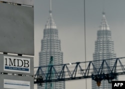 FILE - In this file photo taken on July 3 2015 the 1 Malaysia Development Berhad (1MDB) logo is seen on a billboard at the funds flagship Tun Razak Exchange under-development site in Kuala Lumpur.