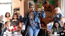 Drag king Hank VanDickerson performing in a mock election at Cafecito Bonito in Anchorage, Alaska, where people ranked the performances by drag performers, July 28, 2022. 