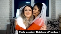 Netchanok 'Love' Promkao and Dmytro 'Jane"'Denysov hug each other in a YouTube video clip, where they talk about their marriage situation.
