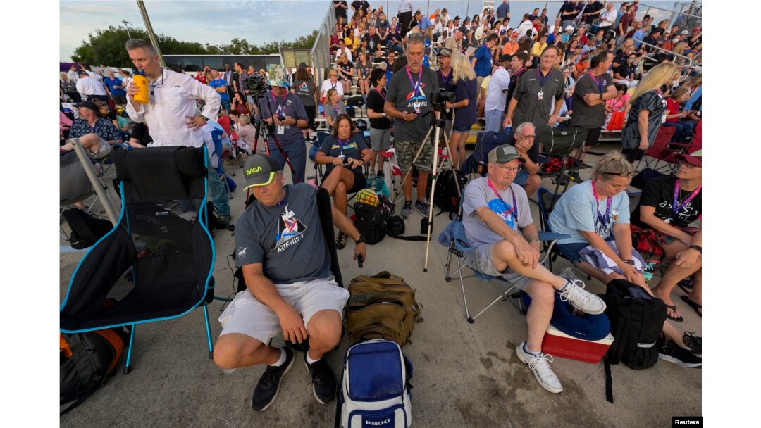 FILE - Spectators wait for the launch of NASA's next-generation moon rocket, the Space Launch System, with its Orion crew capsule on top, on the unmanned Artemis 1 mission, which was later scrubbed, at Cape Canaveral, Florida, U.S., August 29, 2022.