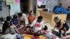 Members of an HIV activist group run a protest in front of the Delhi office of the National AIDS Control Organisation, demanding a regular supply of antiretroviral therapy drugs. (Jitendra Jha for VOA)