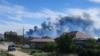 Smoke rises after explosions were heard from the direction of a Russian military airbase near Novofedorivka, on Ukraine’s Crimean Peninsula, Aug. 9, 2022.