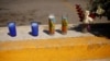 Candles and flowers are seen where unknown assailants killed employees of a radio station, including an announcer while they were outside, according to local media, in Ciudad Juarez, Mexico, Aug. 13, 2022.