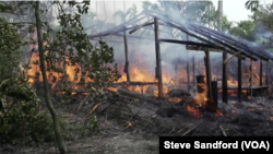 A village hut burns to the ground in Rakhine in September 2017.