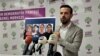 HDP Deputy Huseyin Kacmaz holding the photos of the teenagers killed in Turkish airstrikes