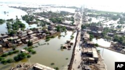 Homes are surrounded by floodwaters in Sohbat Pur city of Jaffarabad, a district of Pakistan's southwestern Baluchistan province, Aug. 29, 2022.