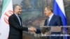 Russian Foreign Minister Sergey Lavrov, right, and Iranian Foreign Minister Hossein Amir-Abdollahian shake hands after a joint news conference following their talks in Moscow, Russia, Aug. 31, 2022. 