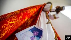 An image of Bishop Rolando Alvarez is pinned to a robe on a statue of Jesus Christ at the Cathedral in Matagalpa, Nicaragua, Aug. 19, 2022. 