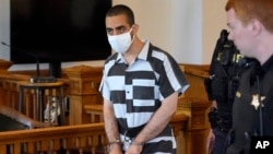 FILE - Hadi Matar, the accused attacker of author Salman Rushdie, arrives for an arraignment in the Chautauqua County Courthouse in Mayville, New York, Aug. 13, 2022.