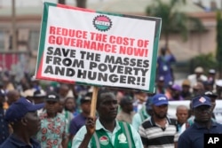 FILE - Nigeria Labour union protest in solidarity with the Academic Staff Union of Universities, on the street in Lagos, Nigeria, on July 26, 2022.