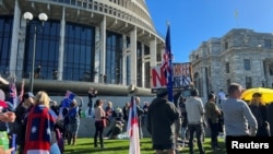 Protesters gather on the grounds of New Zealand Parliament, as they demonstrate against what they consider as government encroachment on freedoms, in Wellington, New Zealand, Aug. 23, 2022. 