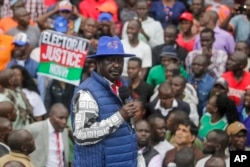 FILE - Presidential candidate Raila Odinga speaks to supporters as he arrives at his campaign headquarters after submitting a petition at the Supreme Court in Nairobi, Kenya, Aug. 22, 2022.