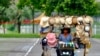 Wang Shang-chi, 75, a mobile hats vender, rides his bike on a parking lot next to the Taipei City Zoo, Taiwan.