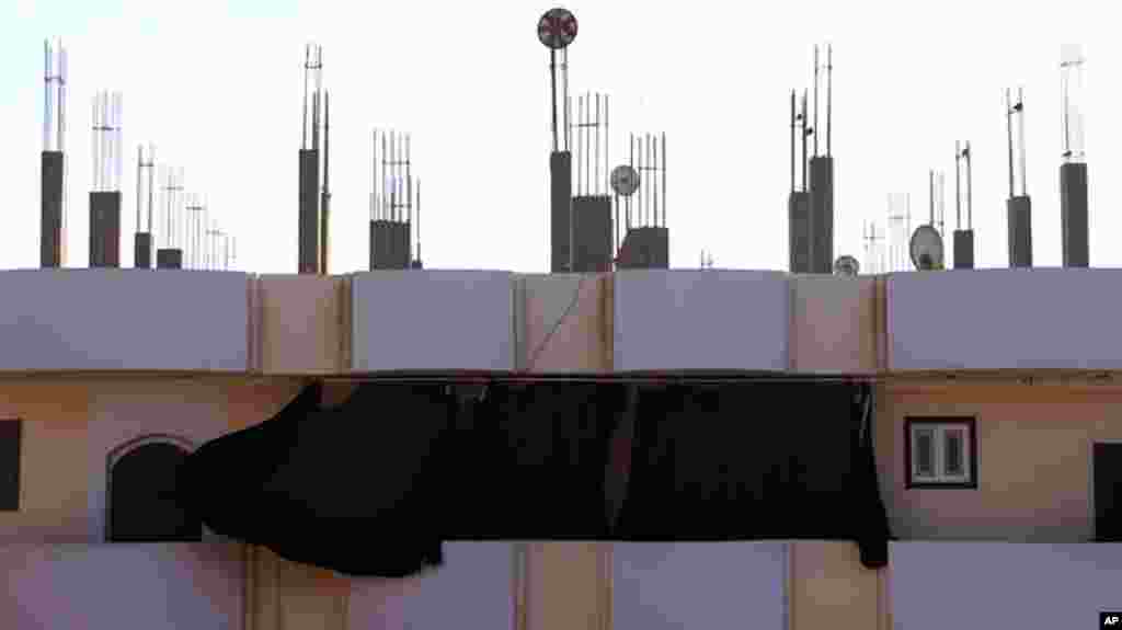 But even in the village, satellite dishes bring news of events roiling the nation and the region, Kafr Torky, February 13, 2011 (VOA photo - E. Arrott)