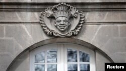 FILE—An ornamental mask referring to the transatlantic trafficking of enslaved Africans is seen on a former Nantes shipowners' building in Nantes, France, March 25, 2024.