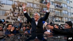 Sebastian Pinera, Chile's former president who is a candidate in the presidential primary election, waves after voting in his party's primary election in Santiago, Chile, July 2, 2017.