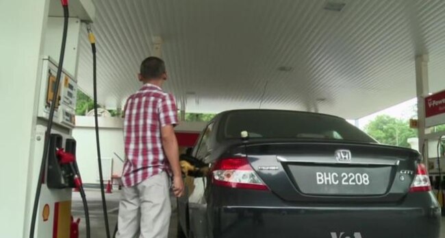Malaysians Brace As Government Cuts Key Subsidies to Balance Budget