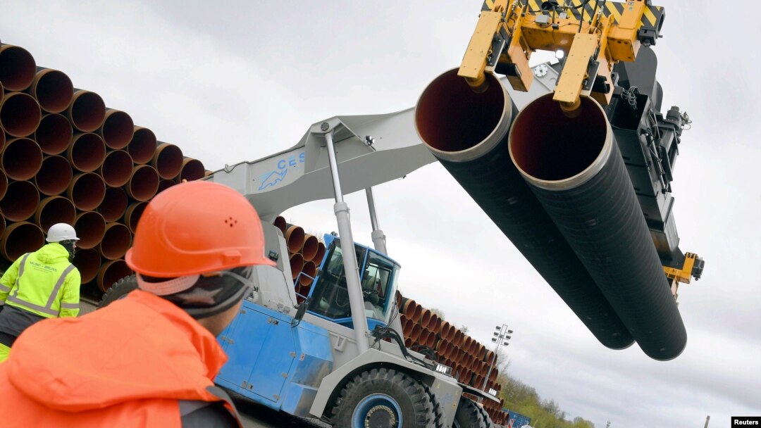 FILE - Steel pipes for the North Stream 2 pipeline are uploaded in Mukran harbour in Sassnitz, Germany, May 8, 2017. 