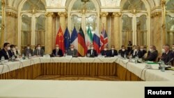 FILE - Officials wait for the start of a meeting of the JCPOA Joint Commission in Vienna, Austria, Nov. 29, 2021. (EU Delegation in Vienna/Handout via Reuters)