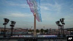 Alpha Jets from the Patrouille de France fly over the Place de la Concorde during the Opening Ceremony for the 2024 Paralympics on Aug. 28, 2024, in Paris, France.